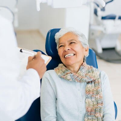 woman getting white dental filling image