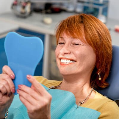 lady at root canal dentist image